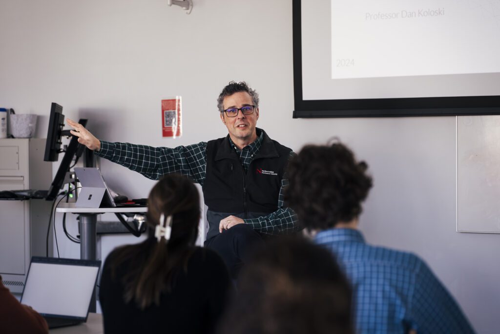 A Northeastern instructor leading an applied learning session
